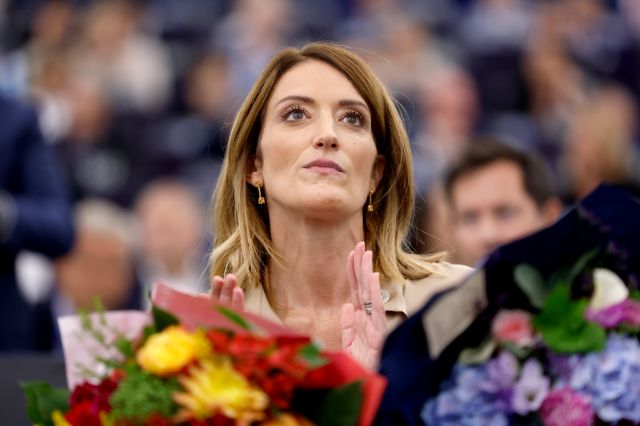 European Parliament President Roberta Metsola receives flowers during the opening plenary of the newly-elected European Parliament in Strasbourg, eastern France, Tuesday, July 16, 2024. (AP Photo/Jean-Francois Badias)