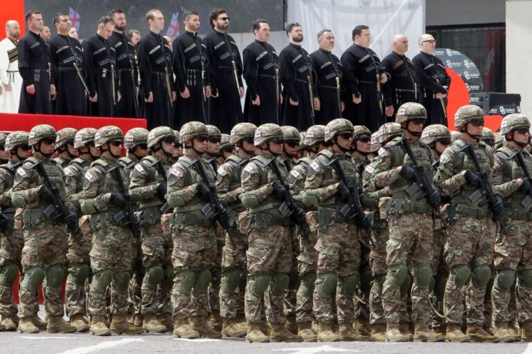 Georgian troops stand ready to march during the celebration of the Independence Day in Tbilisi, Georgia, Monday, May 26, 2025. (AP Photo/Shakh Aivazov)