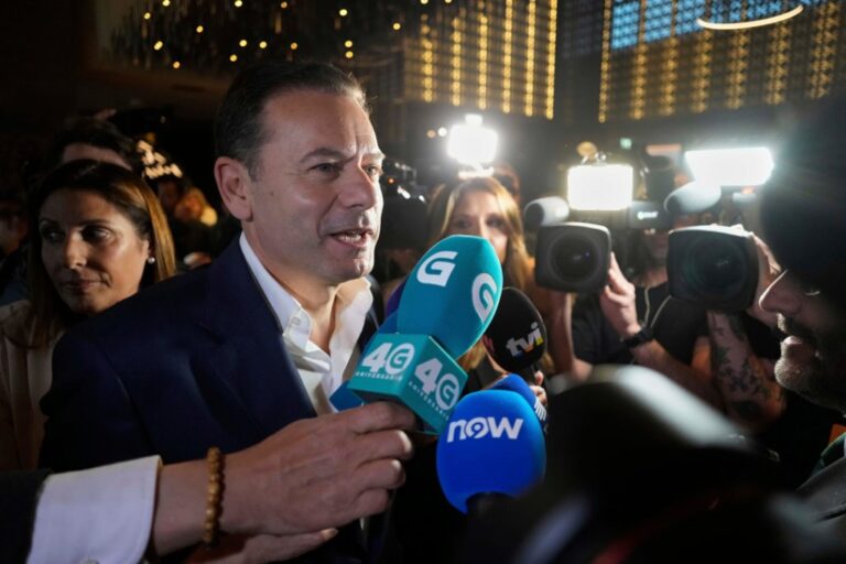 Incumbent Prime Minister and leader of the center-right Social Democratic Party Luis Montenegro arrives at the party's headquarters following Portugal's general election, in Lisbon, Sunday, May 18, 2025. (AP Photo/Armando Franca)