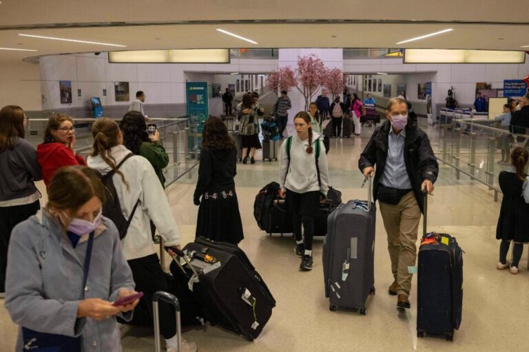 People carrying suitcases arrive from international flight at Newark Liberty International Airport, Monday, June 9, 2025, in New Jersey. (AP Photo/Yuki Iwamura)